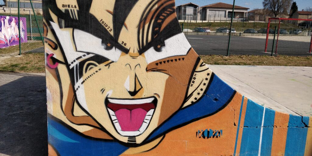 Graphiti de Moya Uno au skate park de St Jean de Vedas représentant Songoku avec la touche des îles